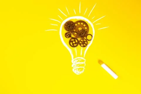 Light bulb with gears and cogs on yellow background. Business idea concept Stock Photos