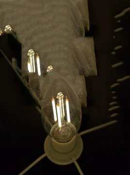 Light bulb glowing in the dark Stock Photos
