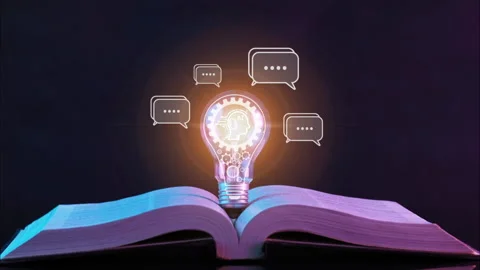 Light bulb glowing on open book with AI icons chatting with digital chatbot Stock Footage 236296686
