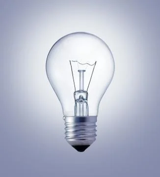 Light bulb on the gray surface Stock Photos