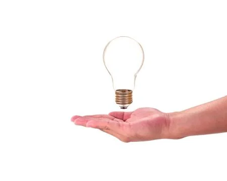 Light bulb in hand, idea concept Stock Photos