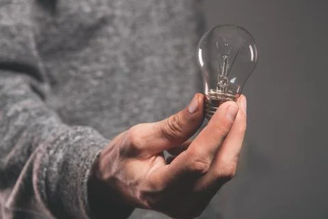 Light bulb with hand idea Stock Photos