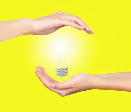Light bulb hand Stock Photos