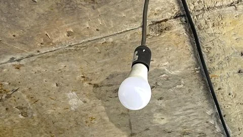 Light bulb hanging from the ceiling Stock Photos