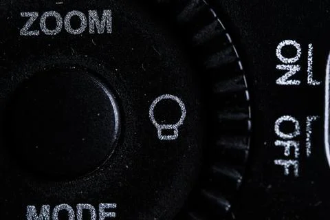 The light bulb icon button is close on the flash for camera device. Old and.. Stock-Fotos