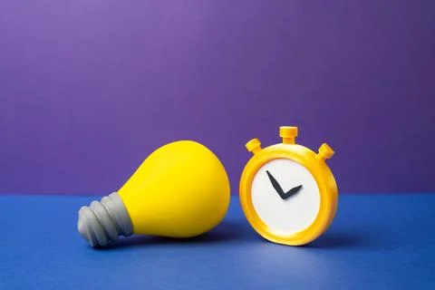 A light bulb, an idea, and a stopwatch. The relevance of the idea. Creativity 스톡 사진