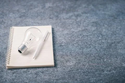 Light bulb idea concept on notebook represents education learning and creat.. Stock Photos