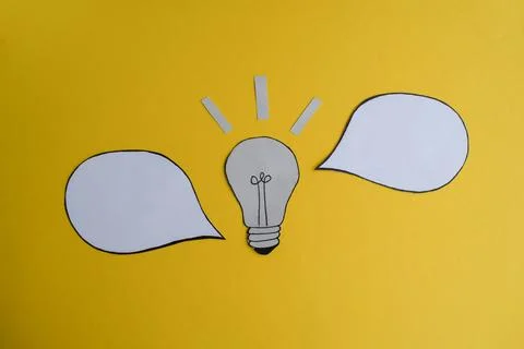Light Bulb Idea with Speech Bubbles on Yellow Stock Photos