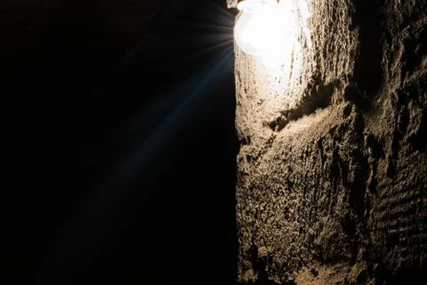 Light bulb illuminating wall Stock Photos