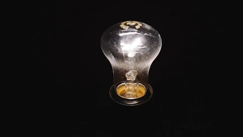 Light Bulb Isolated On Black Background Stock Footage 102228548