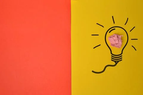 Light bulb isolated on yellow background 스톡 사진