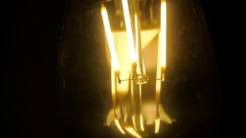 Light bulb lamp on black background. Edison light bulbs in darkness Stock Footage 126582175