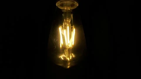 Light bulb lamp on black background. Edison light bulbs in darkness Stock Footage 126583891
