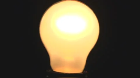 Light bulb lights up. Full HD 1080 video footage. Video stock 54937220