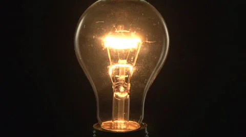 Light bulb lights up. Full HD 1080 video footage. Video stock 54937338