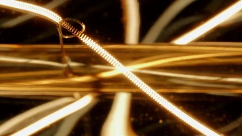 Light Bulb In Macro On Black Background Stock Footage 74688039