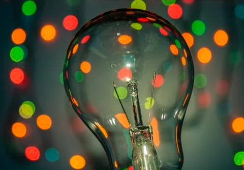 Light bulb on multicolored lights background, I have an idea !! Stock Photos
