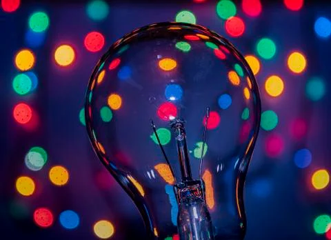 Light bulb on multicolored lights background, I have an idea !! Stock Photos