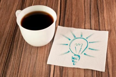Light bulb on a napkin Stock Photos