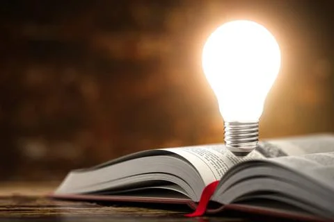 Light bulb on the open book. Idea and creativity concept background. 3 Lig... Stock Photos