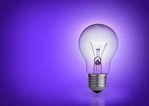 Light bulb on purple background. Photos