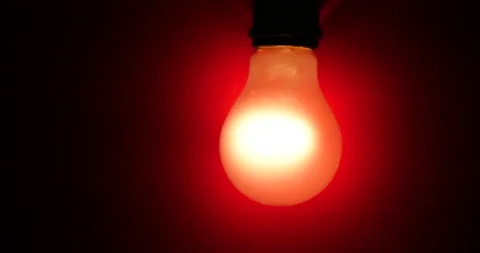 Light bulb on red wall background Видео 162617973