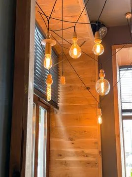 Light bulb in room with windows Stock Photos