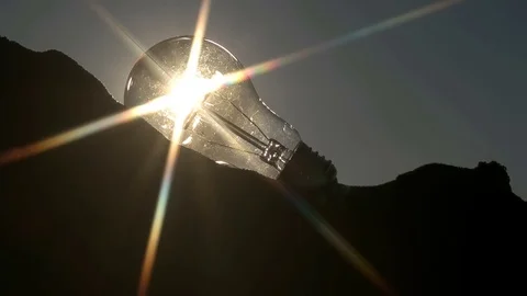 Light bulb on the sand beach Stock Footage 76846518