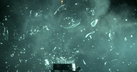 Light Bulb Shatters into Tiny Pieces Stock Footage 77781366