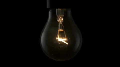 Light bulb swinging and flickering. 4k Black background Stock Footage 89648830