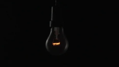 Light bulb swinging to camera. Slow motion. Stock Footage 72607630