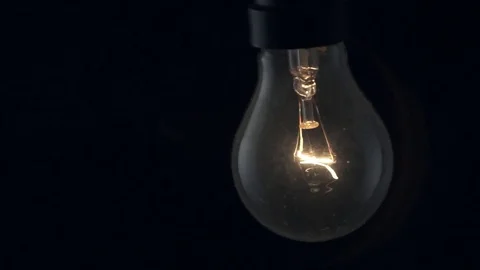Light bulb swinging slightly. Stock Footage 72607381