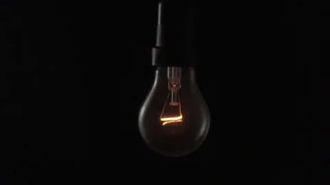 Light bulb swinging. Slow motion. Stock Footage 72607594