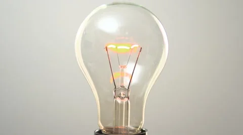 Light bulb is switched on a light background. Full HD 1080 video footage. Stock-Footage 55822039