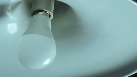 Light Bulb Turned Off by Twisting Stock Footage 146759861