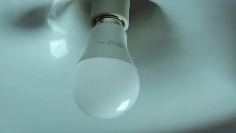 Light Bulb Turned Off by Twisting Stock Footage 146782321