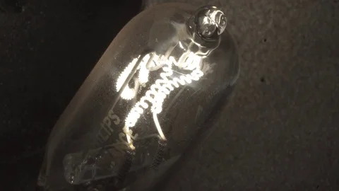 Light Bulb turning on and off Stock Footage 76355083