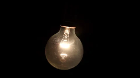 Light bulb turns on and off Stock Footage 8600639