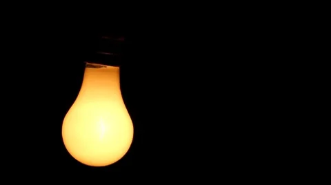 Light bulb turns on and off Stock Footage 8600643