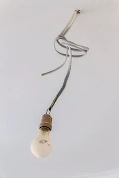 Light bulb on the wire Stock Photos