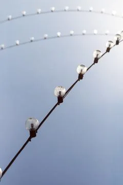 Light bulbs on the background of a clear sky Stock Photos