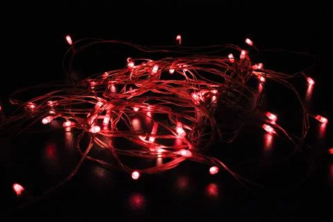 Light bulbs on dark background with selective focus Stock Photos