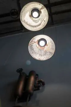 Light bulbs hanging from ceiling Stock Photos
