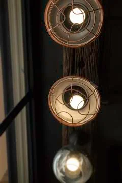 Light bulbs hanging from ceiling Stock Photos