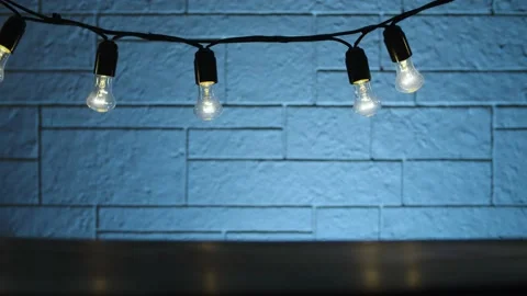 Light bulbs over the table Stock Footage 142885610