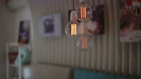 Light bulbs removed close up on a background of paintings Stock Footage 64045910