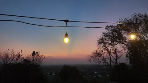 Light bulbs serve as lighting and accessories in aesthetic hangouts or Stock Footage 341660018