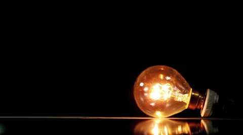 Light bulbs smashing on black background 库存影片 55629042