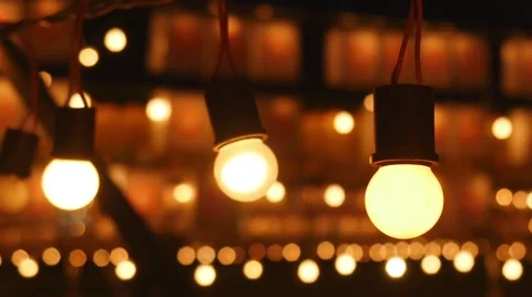Light bulbs swaying in wind, close-up Stock Footage 66300133