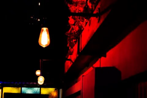 Light bulbs on the wall Stock Photos